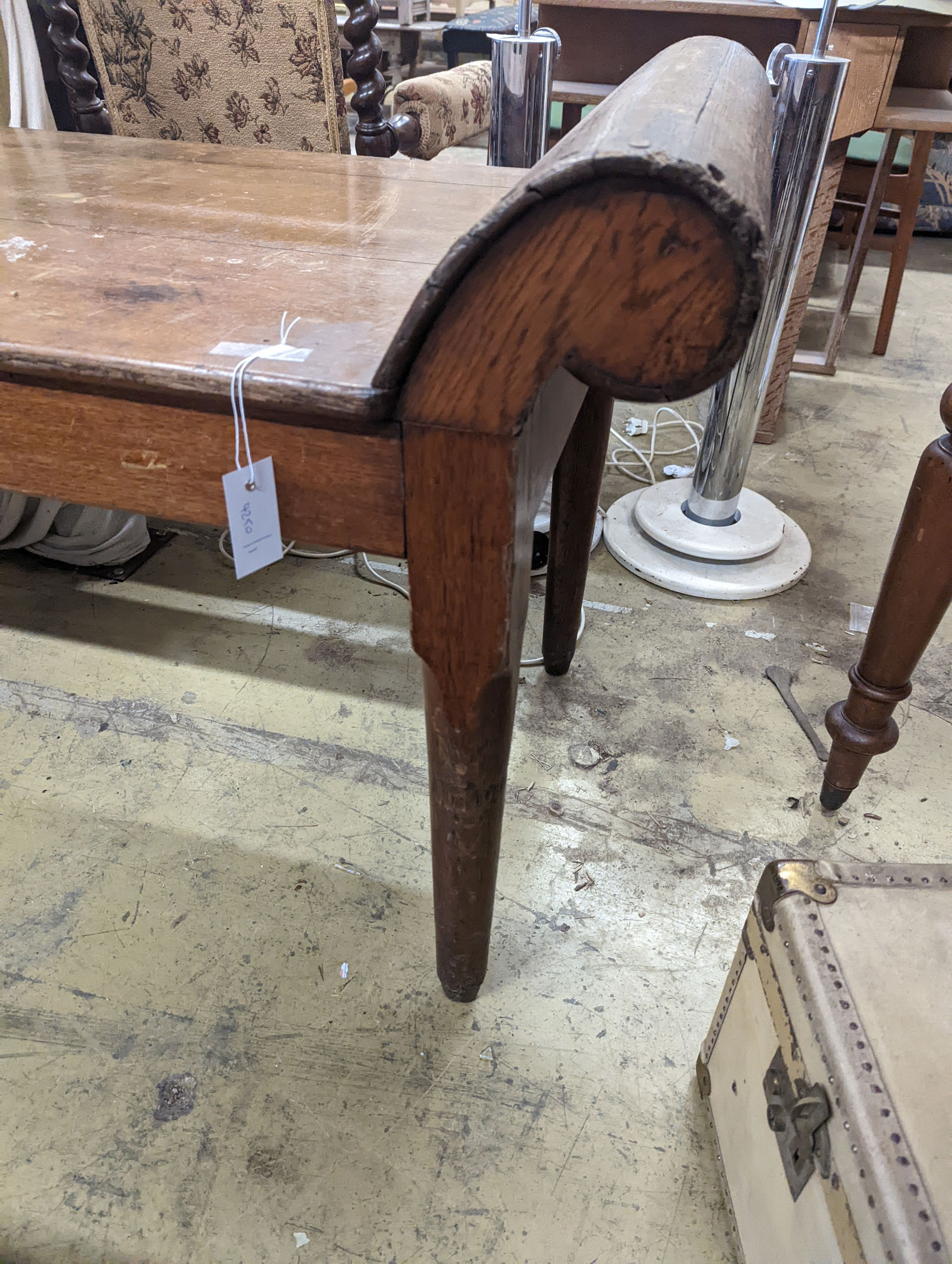 An early 20th century oak examination table, length 180cm, depth 59cm, height 74cm
